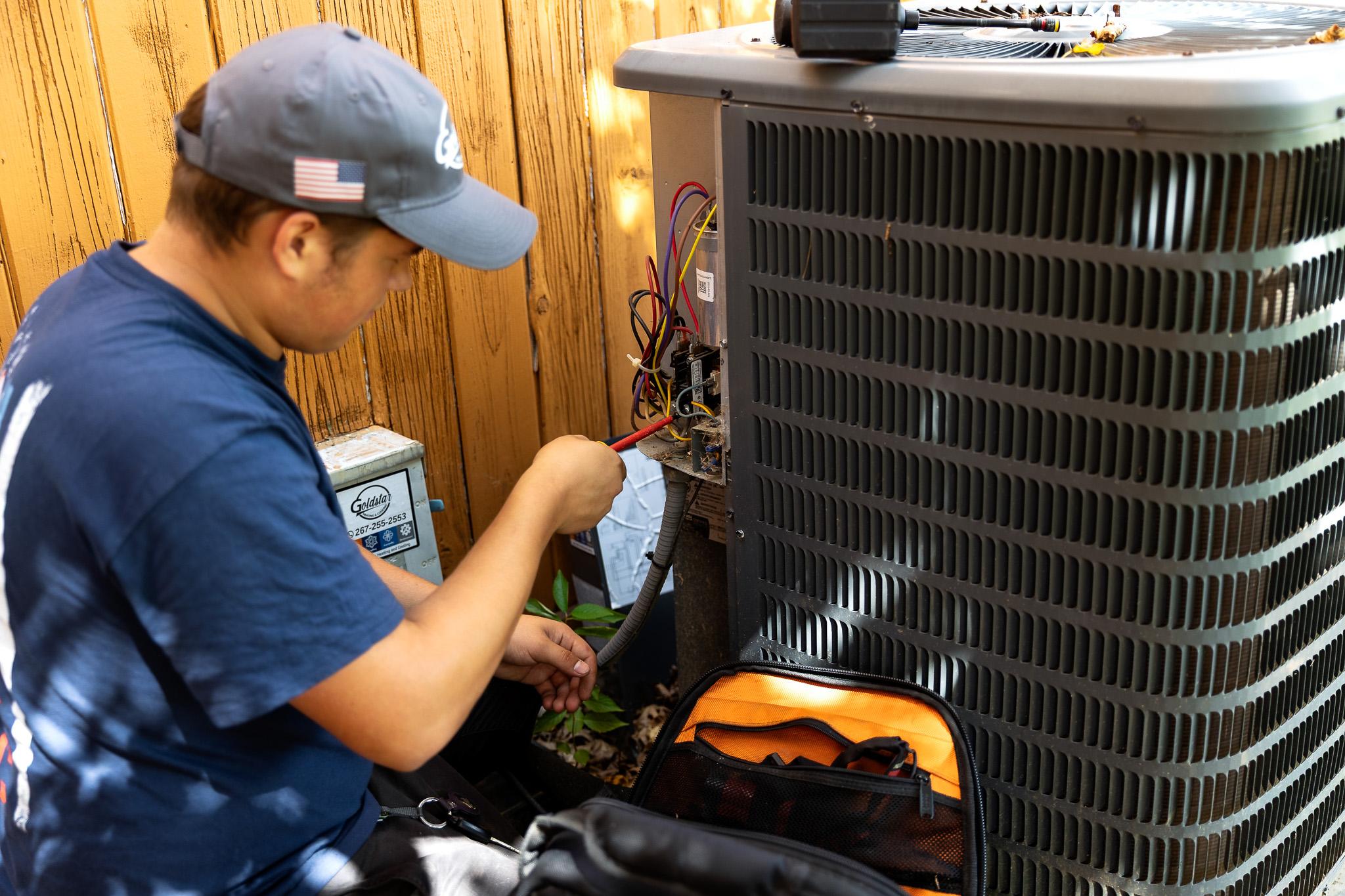 technician working on HVAC unit