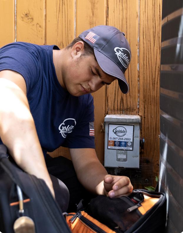 Technician working on hvac unit