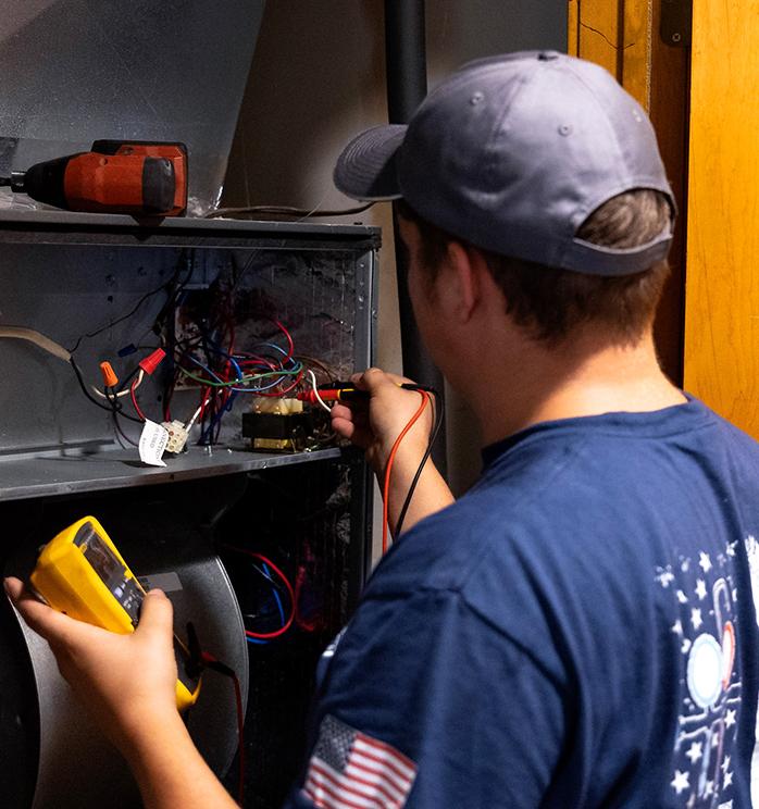 Technician working on wires