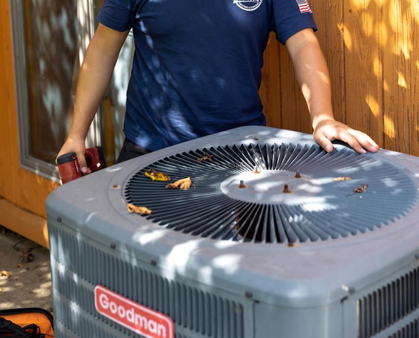 Technician repairing hvac unit