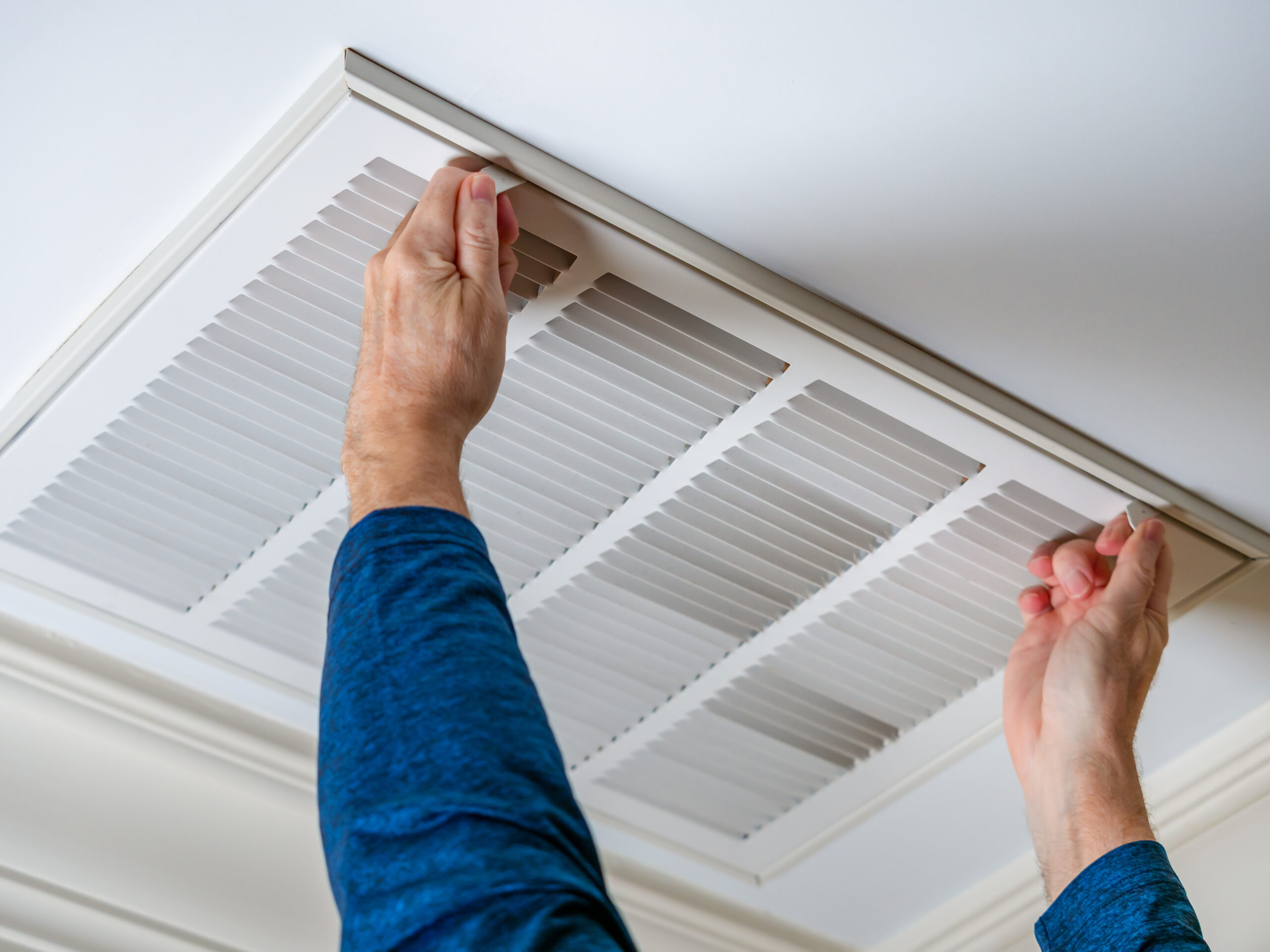 Technician preparing for air duct cleaning